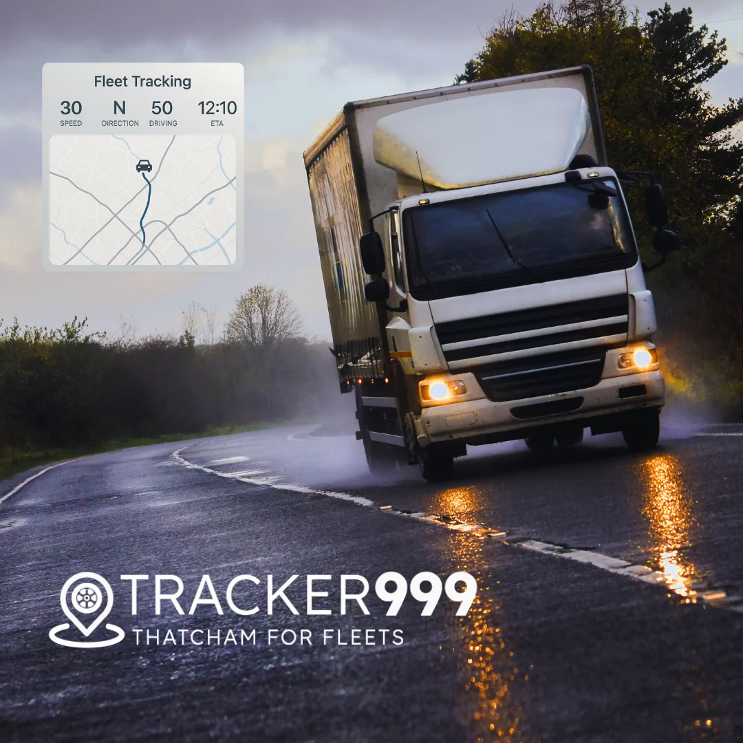 HGV driving on wet road with fleet tracking overlay and Wholesale Telematics branding